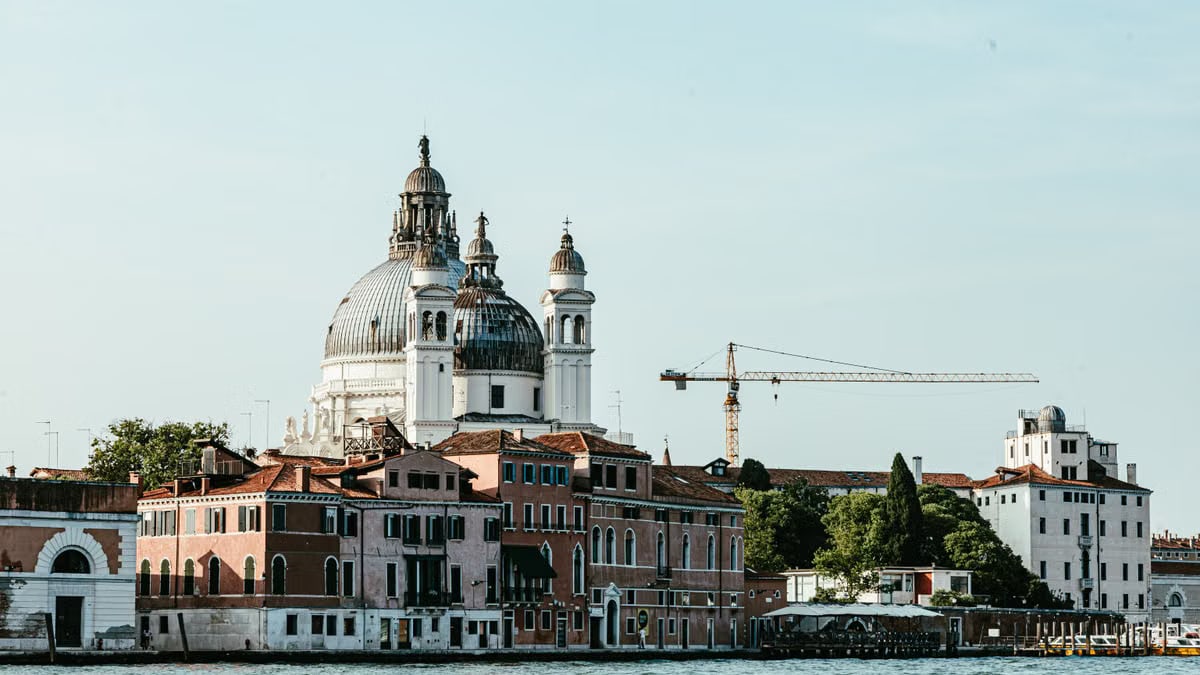 View of Santa Maria della Salute and Venetian architecture on a sunny day.